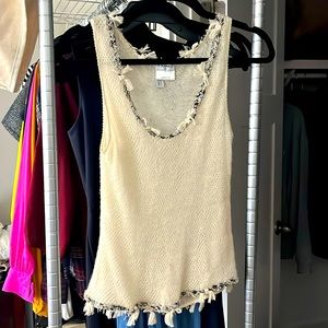 Chanel cashmere top with tweed accents. Minor damage from moths. Minor stain.